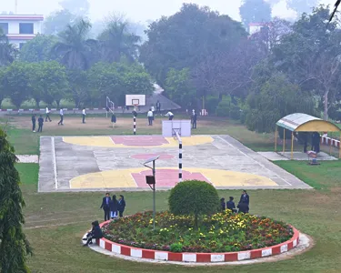 KCMT playground with students engaging in sports and outdoor activities